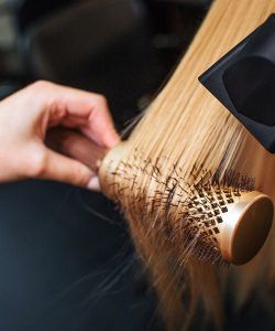 Hair being brushed at a luxury hair salon in downtown Scranton